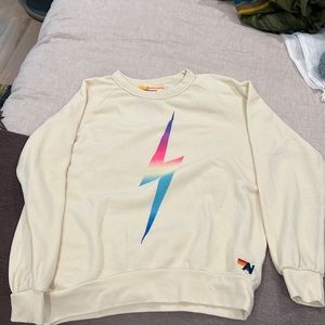 Aviator Nation crew neck sweatshirt in offwhite with neon lightning bolt.
